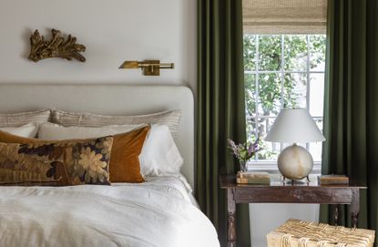 What should you not do in a bedroom layout? white bedroom withh green curtains by Marie Flanigan