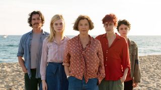 The cast of 20th Century Women stands on a beach