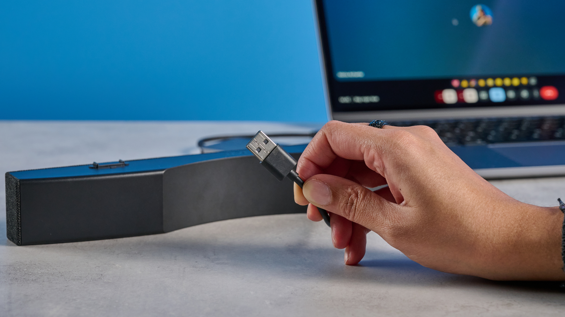 Dell SB725 computing conference soundbar photographed on a blue background
