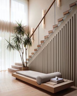 A staircase with a panelled design