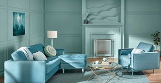 blue living room with blue furniture to show interior paint colour trends 2024