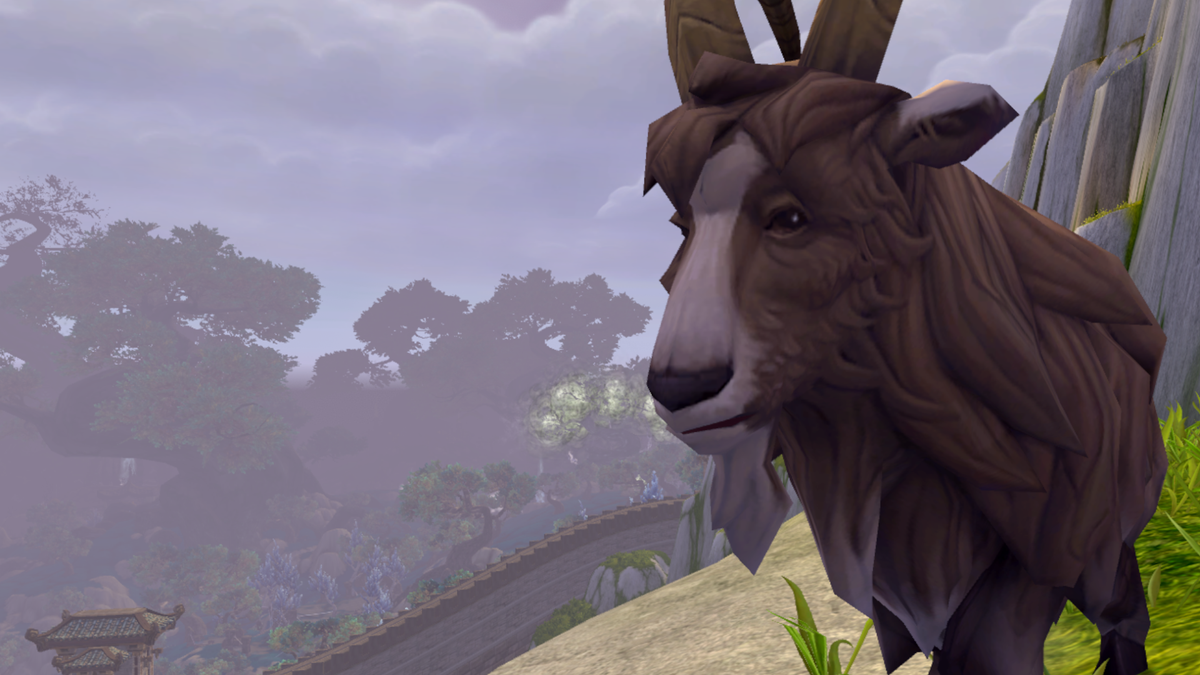 A goat from WoW&#039;s MoP: Remix stares mournfully out over a gorgeous vista.