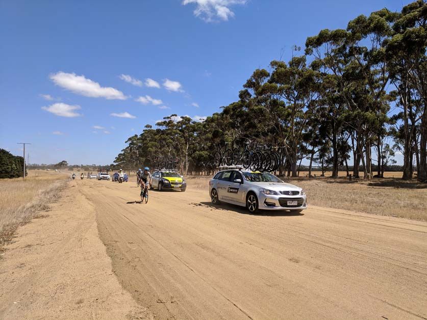Riders struggle down in the race caravan
