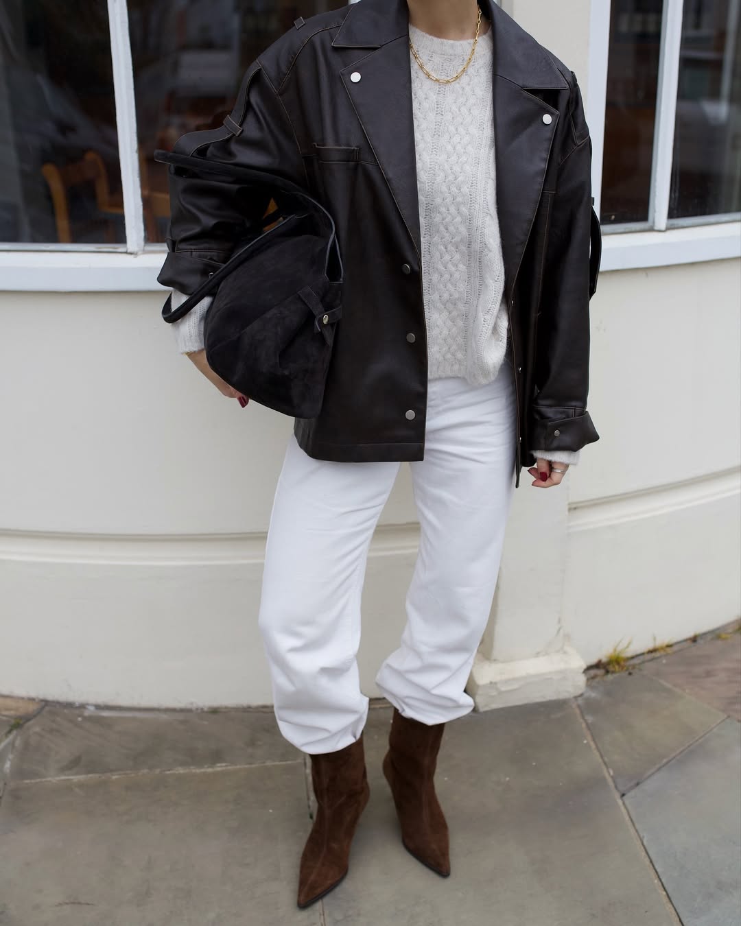Alice Satterthwaite wears a white jeans outfit.