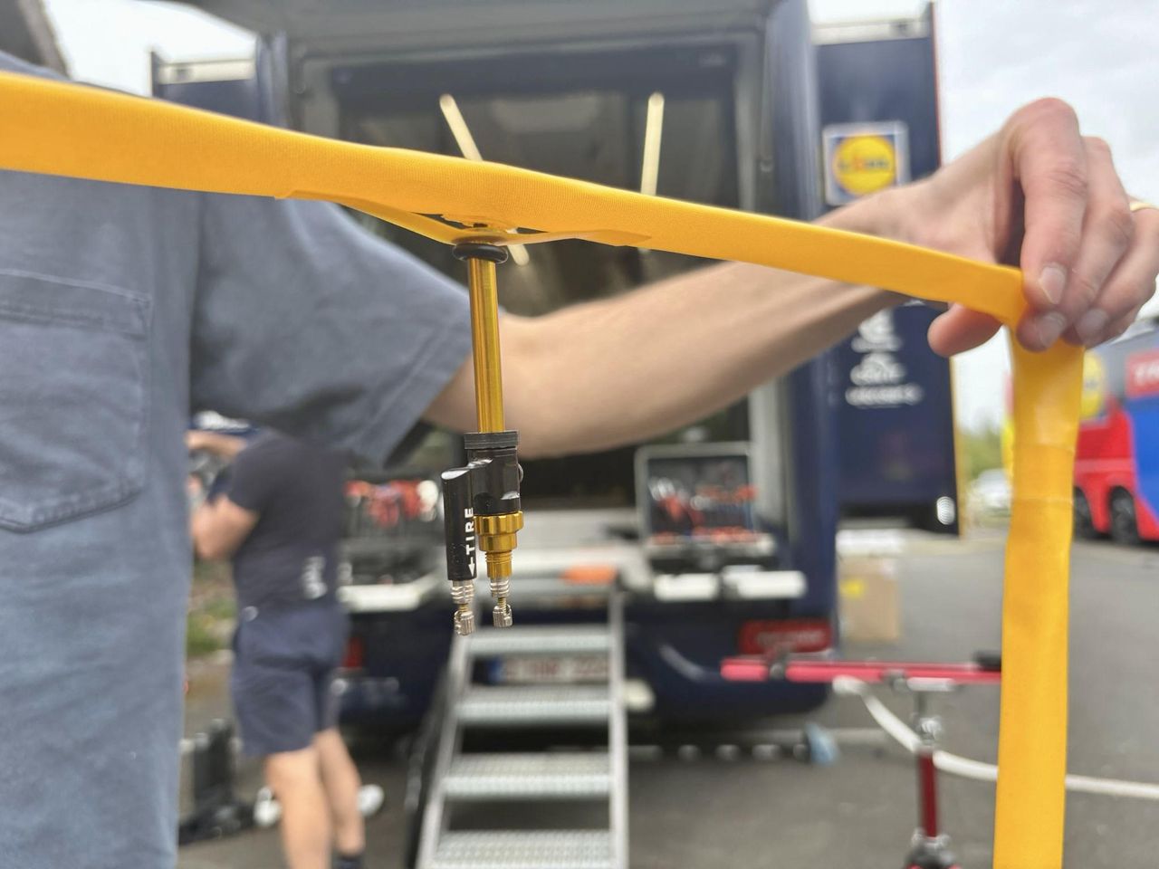 A mechanic holding up an Odyssey tubeless insert