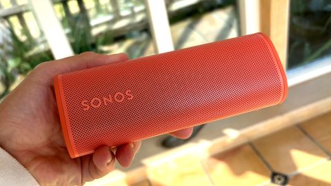 Sonos Roam 2 wireless speaker in red held in hand