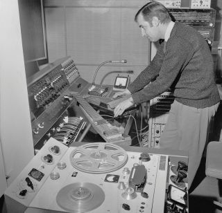 Dick Mills with a lap steel guitar and a zither at the BBC Radiophonic Workshop in Maida Vale Studios, London, 1969