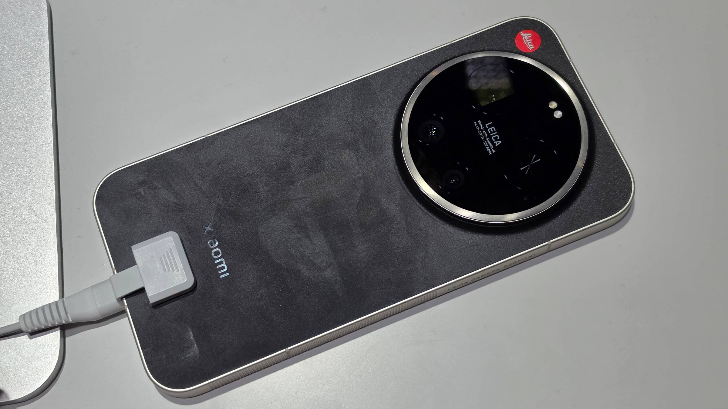 The Leica Leitzphone face down on a table.