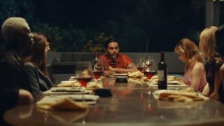 The Weeknd (and other members of the cast) sitting around a table on The Idol