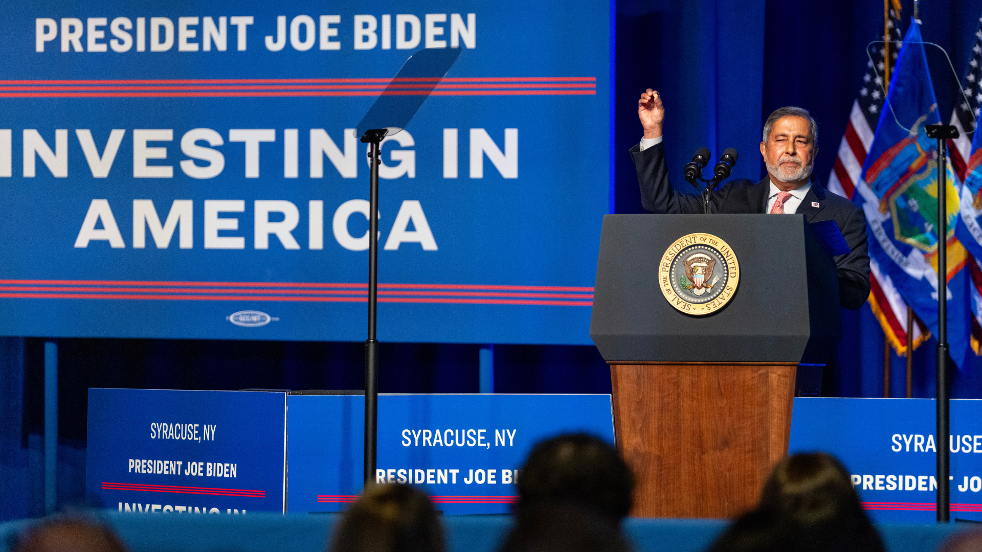 Sanjay Mehrotra, president and chief executive officer of Micron Technology Inc., holds up a microchip while speaking during an event with US President Joe Biden, not pictured, at the Milton J. Rubenstein Museum of Science and Technology in Syracuse, New York, US, on Thursday, April 25, 2024. The US plans to award Micron Technology Inc. $6.1 billion in grants and as much as $7.5 billion in loans to help the memory-chip maker build new American factories, rounding out a slew of major federal awards for advanced semiconductor manufacturing.