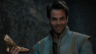 Chris Pine holding a shoe in Into the Woods.