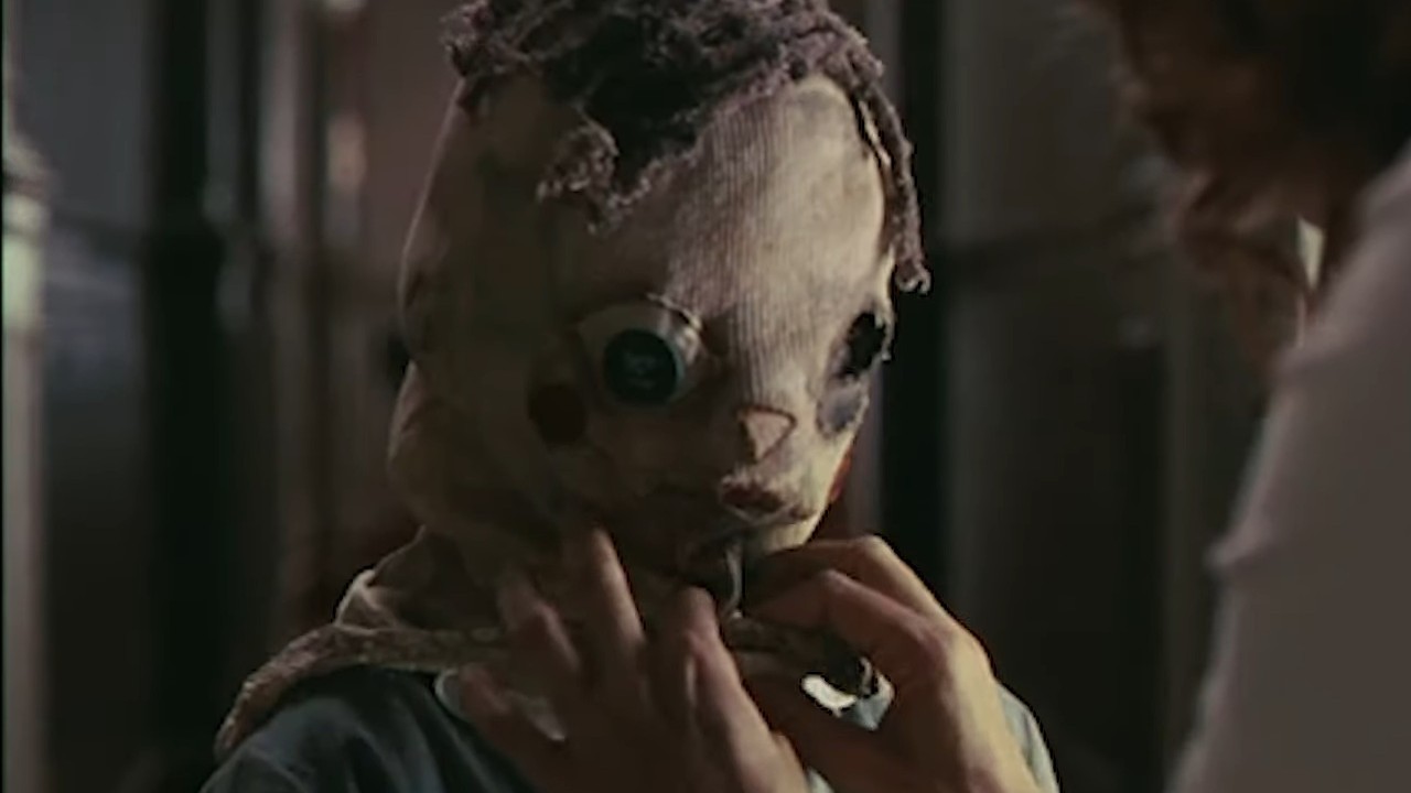Tomas with a sack on his head in the movie, The Orphanage