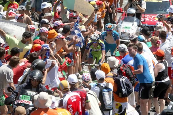 The breakaway squeezes through the enormous crowds atop the Tourmalet.