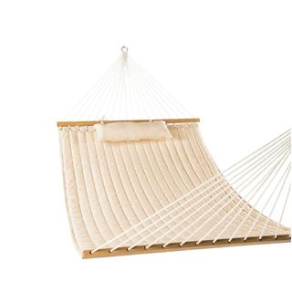 A white hammock with a pillow