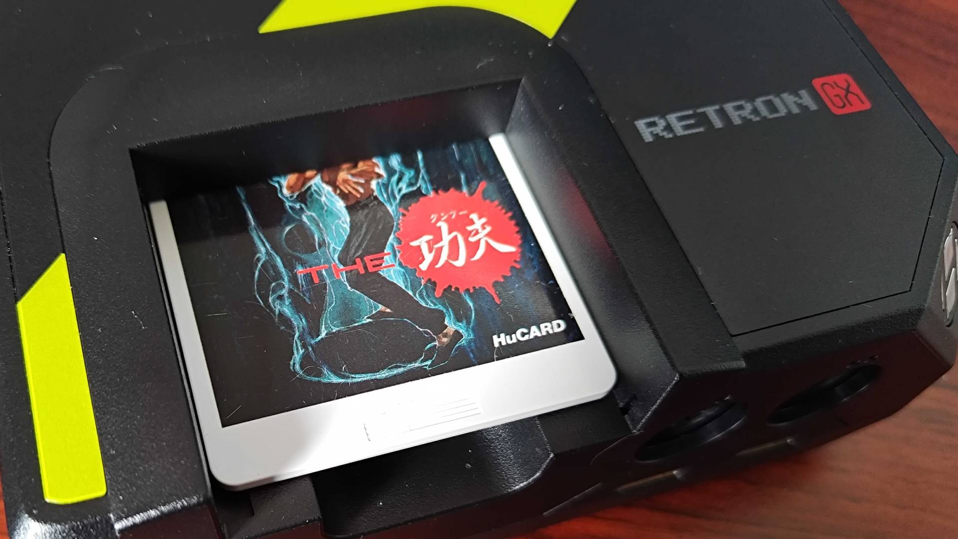 Close up of Hyperkin Retron GX with Hucard in slot.