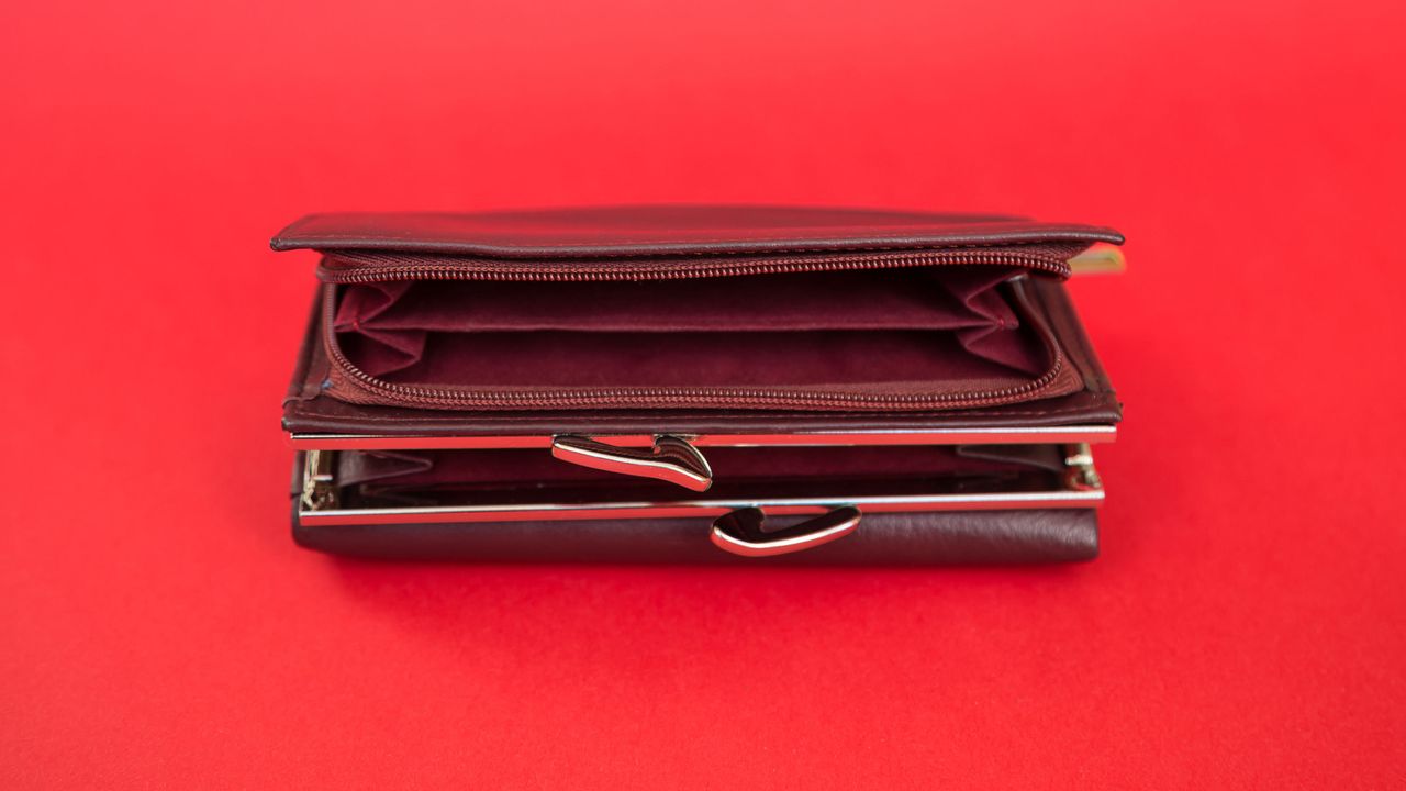 An empty wallet sits open.