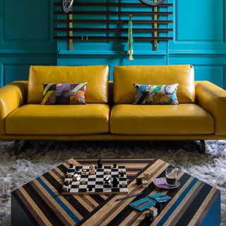living room with tan sofa and rug