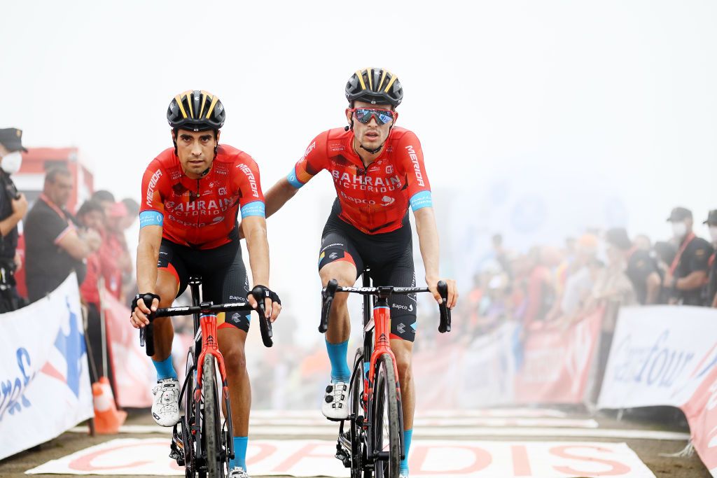 COLLU FANCUAYA SPAIN AUGUST 27 LR Mikel Landa Meana of Spain and Gino Mder of Switzerland and Team Bahrain Victorious cross the finish line during the 77th Tour of Spain 2022 Stage 8 a 1534km stage from Pola de Laviana to Collu Fancuaya 1084m LaVuelta22 WorldTour on August 27 2022 in Collu Fancuaya Spain Photo by Tim de WaeleGetty Images