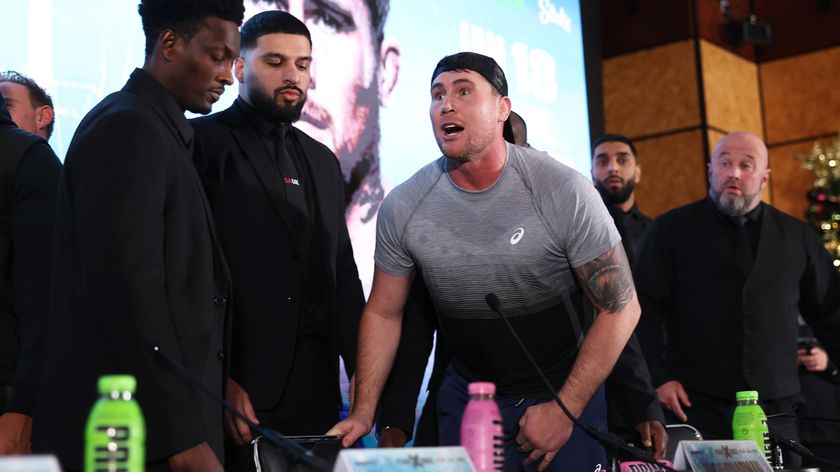 Darren Till angrily leans over the table during the Misfits Boxing press conference