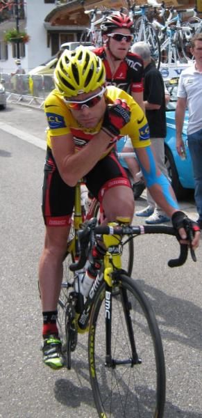 Cadel Evans in yellow and on his yellow bike