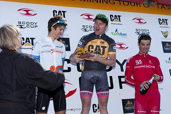 Oh, well this is different: Tour winner Gordon McCauley (Hyster-Total Rush) accepts his trophy on the podium in Westbury.