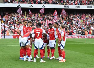 Arsenal squad for 2024/25 LONDON, ENGLAND - AUGUST 31: The Arsenal team huddle before the Premier League match between Arsenal FC and Brighton &amp; Hove Albion FC at Emirates Stadium on August 31, 2024 in London, England. (Photo by Stuart MacFarlane/Arsenal FC via Getty Images)