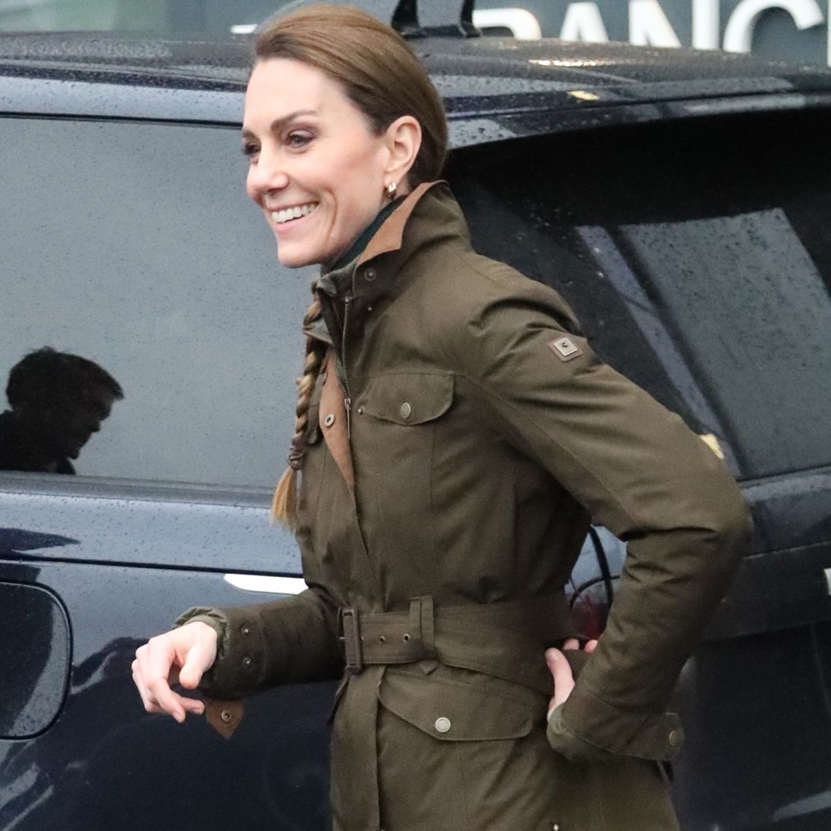 Kate Middleton wears a green army jacket.
