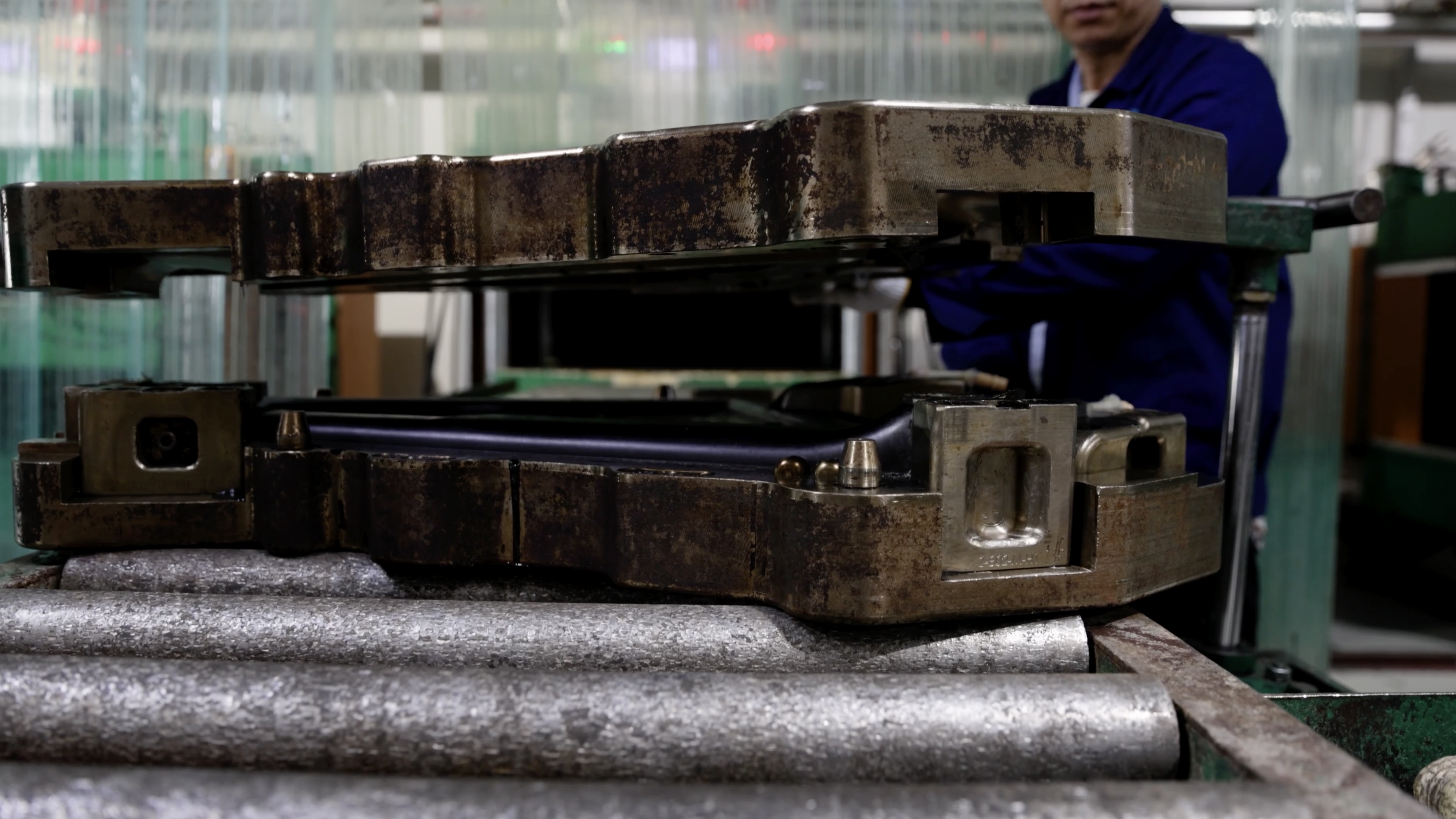 XDS Factory, raw carbon frame being assembled by workers