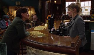 Moira Dingle checks on Charity Dingle at The Woolpack.