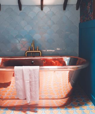 Bronze bath, pink and blue tiles