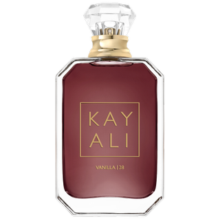 Kayali Vanilla | 28 Eau De Parfum in dark brown hexagonal bottle with gold and clear jewel-shaped cap on light grey background