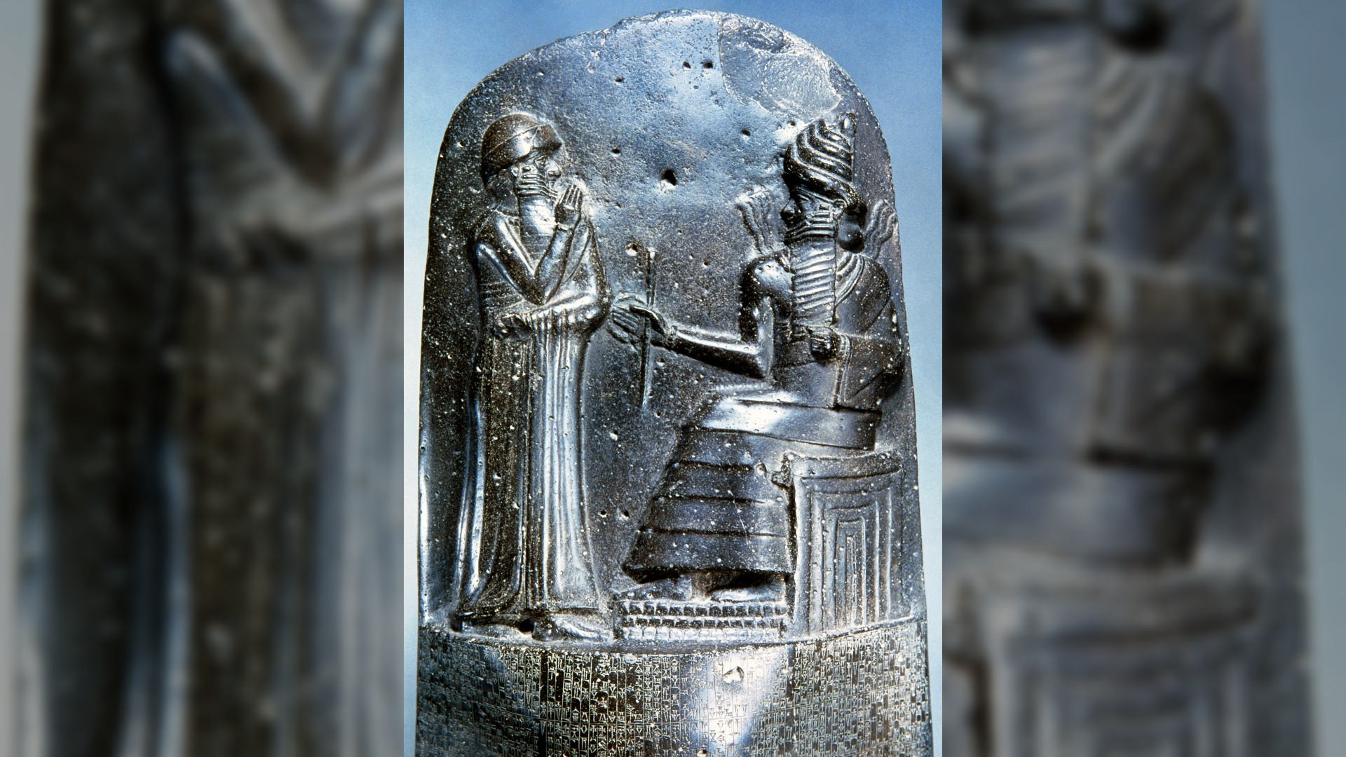 Hammurabi (standing), king of Babylon, depicted as receiving his royal insignia from Shamash, god of justice.