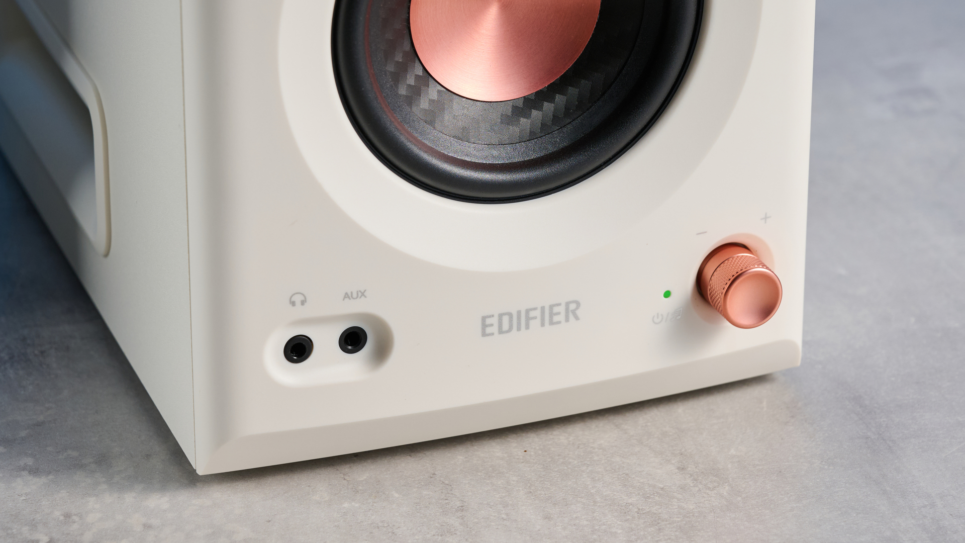 the Edifier MR5 studio monitors bookshelf speakers photographed with the blue tom's guide background