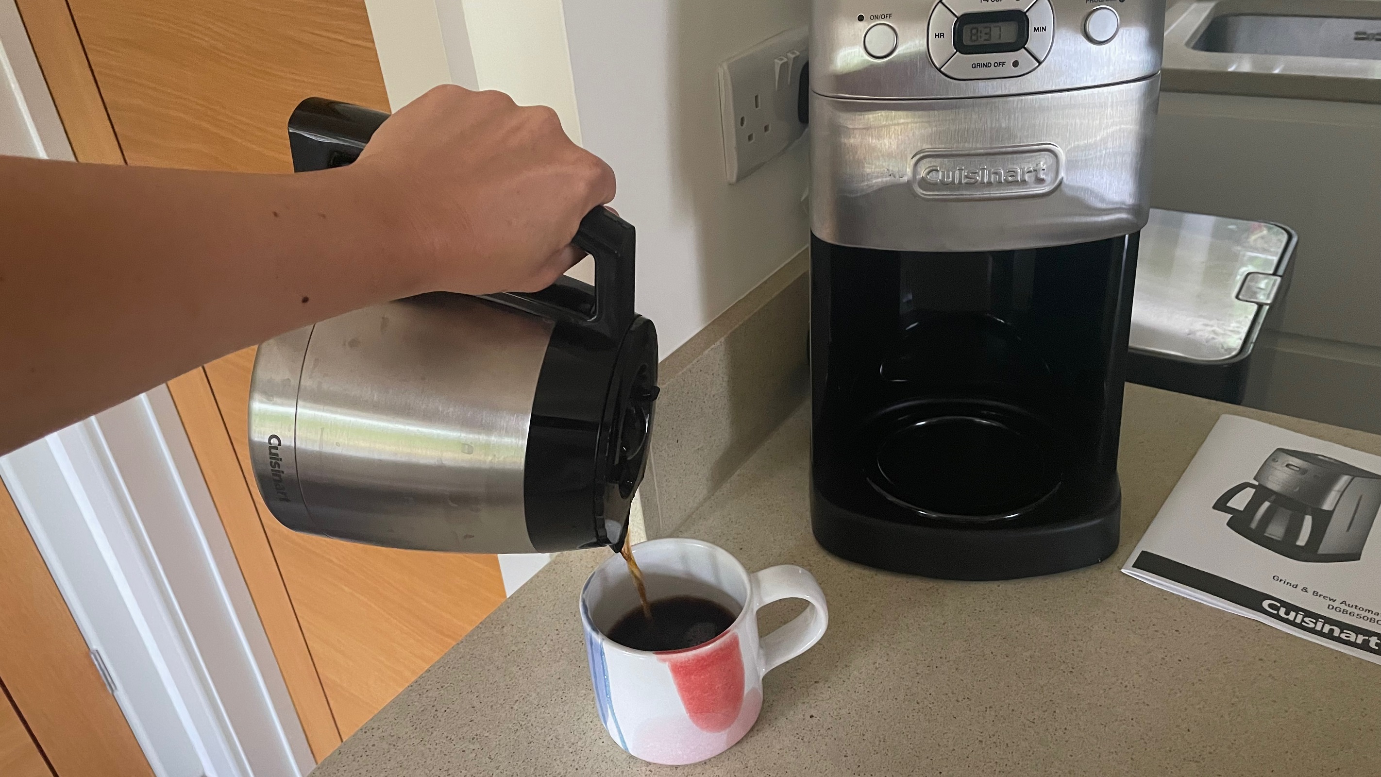 pouring just the right amount of coffee from the Cuisinart carafe