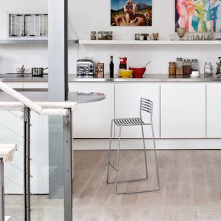 kitchen area with kitchen island and bar stools