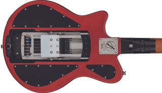 A photo showing the back of a red Ciari Ascender, revealing the mechanism that allows the guitar to fold and unfold.