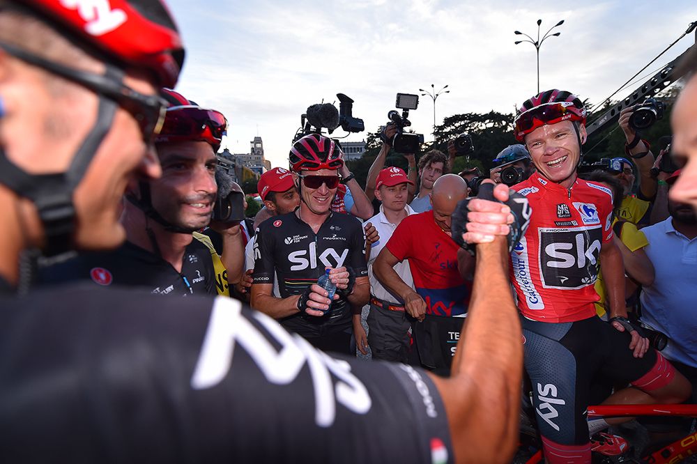 Teammates congratulate Chris Froome after the final Vuelta stage in Madrid