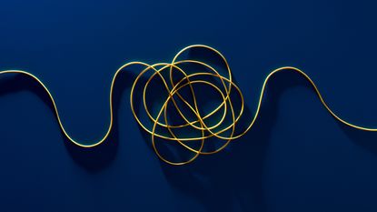 A tangled yellow cord against a dark blue background.