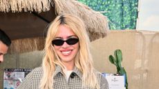 a headshot of billie piper wearing sunglasses