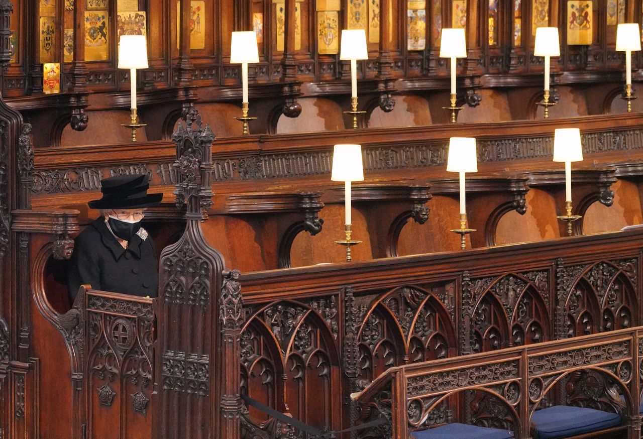 The Queen sits alone at Prince Philip's funeral
