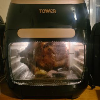 Tower Vortex 5-in-1 air fryer cooking a chicken