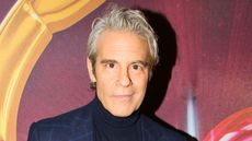 andy cohen on a red background