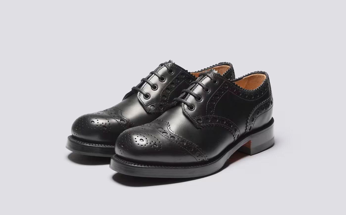 A pair of Grenson black brogues.