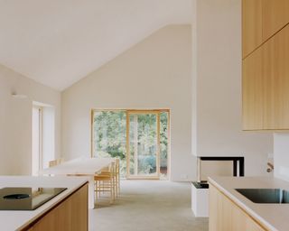 villa koppar by Studio Collaboratorio with its clean minimalist shapes and nordic style white and off white interiors