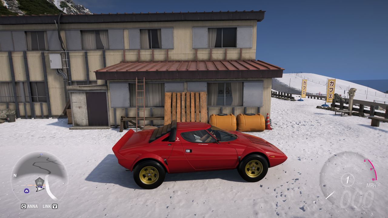 Forza Horizon 6 Treasure Cars: A Lancia Stratos parked next to a lodge in a snowy mountain.