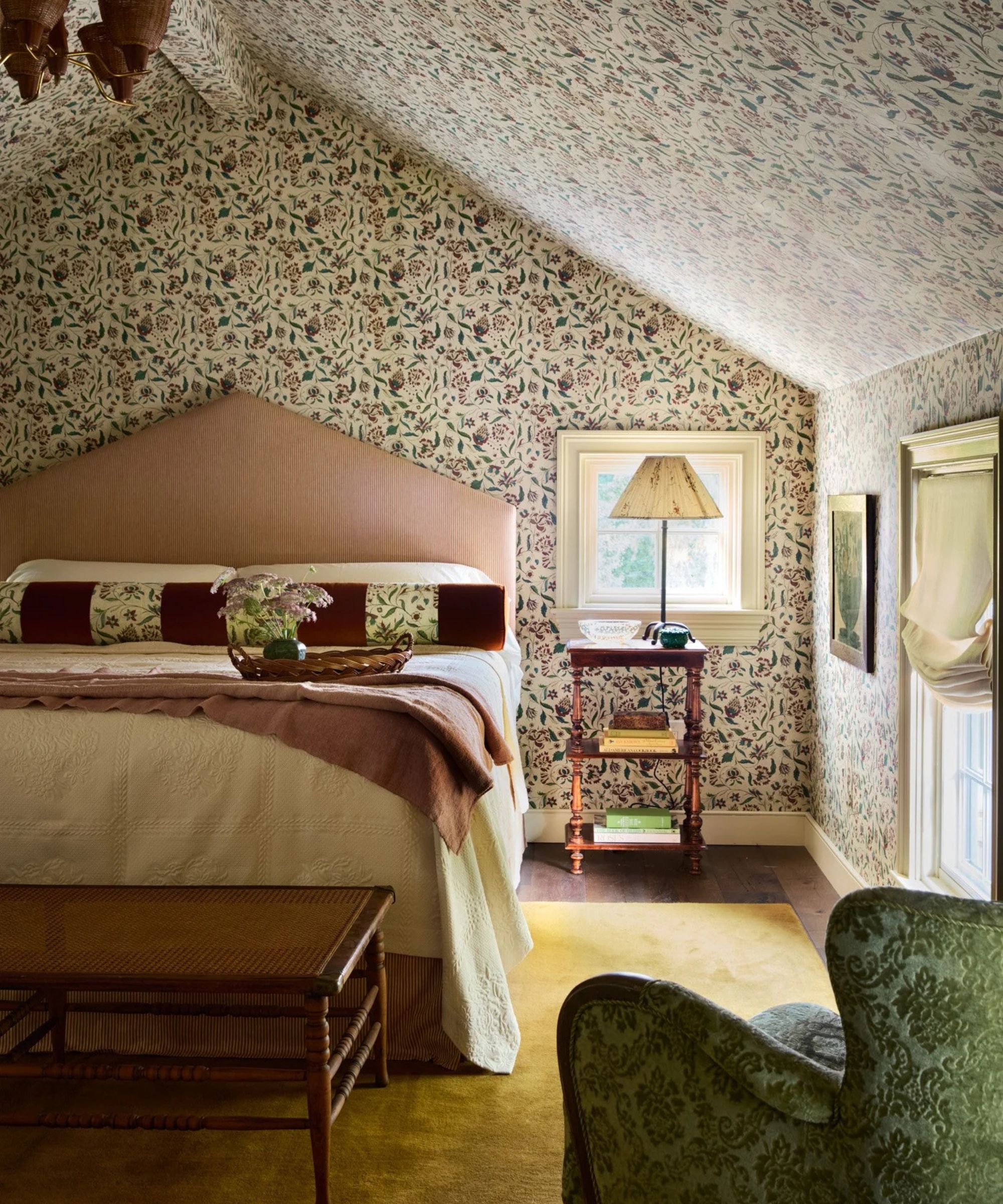 Bedroom in Antionette Poisson wallpaper with Roweam headboard and cushions