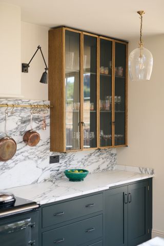 deVOL kitchen cabinetry with glass wall cabinet