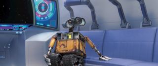 Best animated movie for kids_WALL-E patting couch_WALL-E_Disney PIXAR