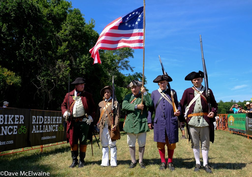 A Revolutionary Honor Guard fired muskets to start the racers