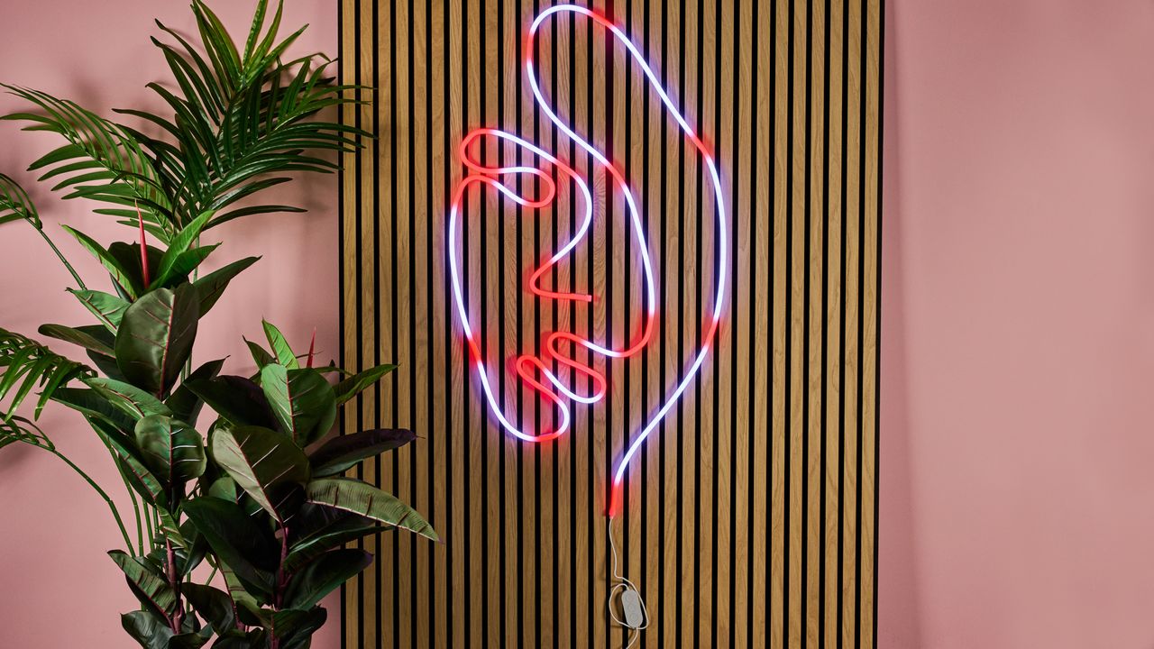 The rope light is lit up white and red to show where to apply the fixing clips.